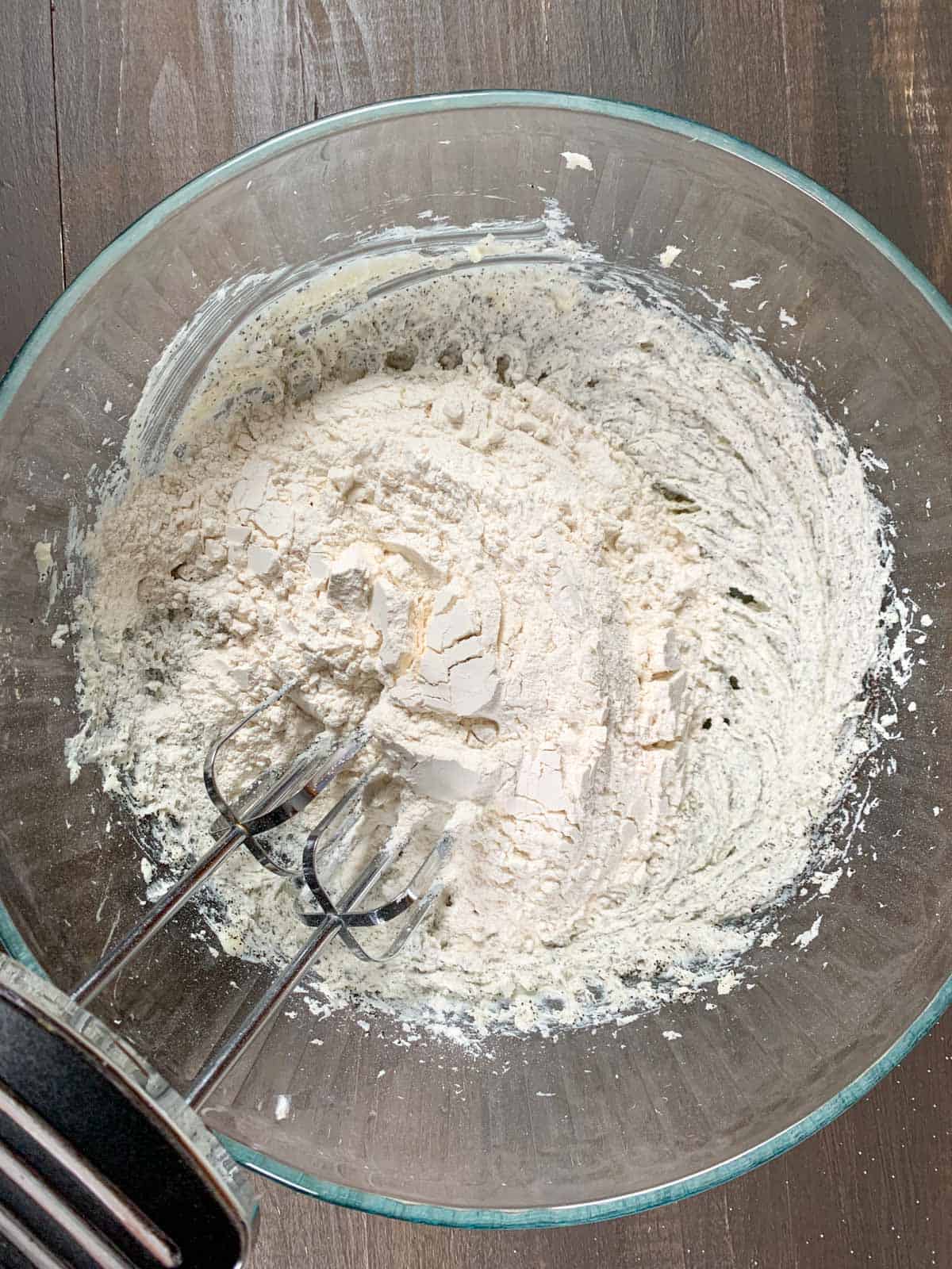adding the all purpose flour to the earl grey shortbread cookies batter.
