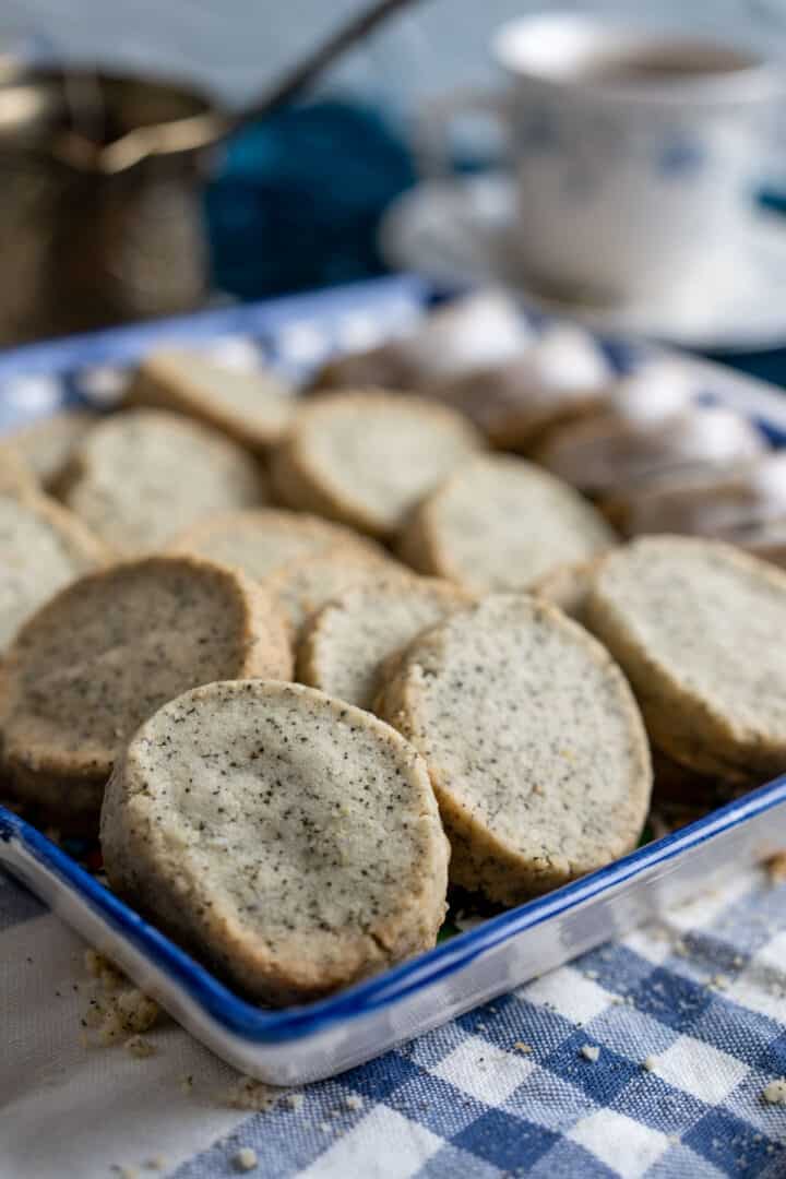 earl grey cookies on a deep blue plate.