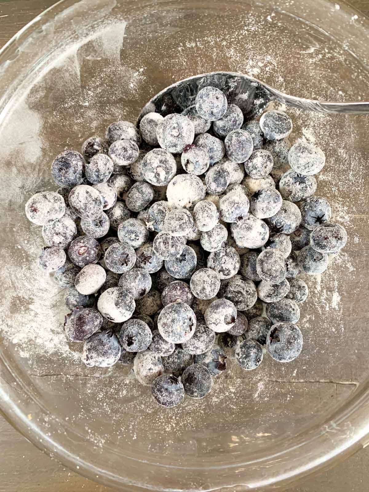 coat the blueberries with all purpose flour.
