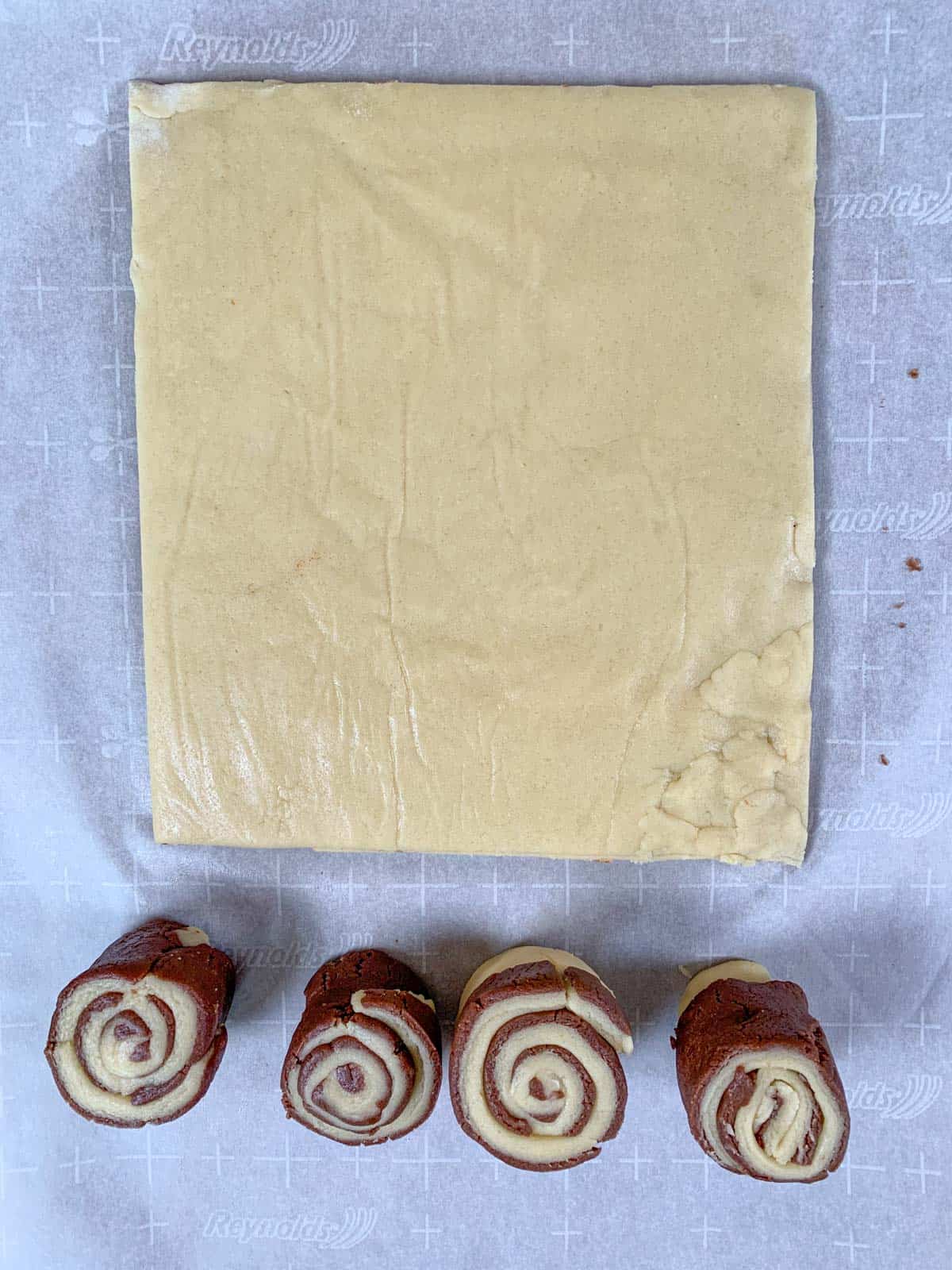 pinwheel cookie dough cut in a large rectangular.