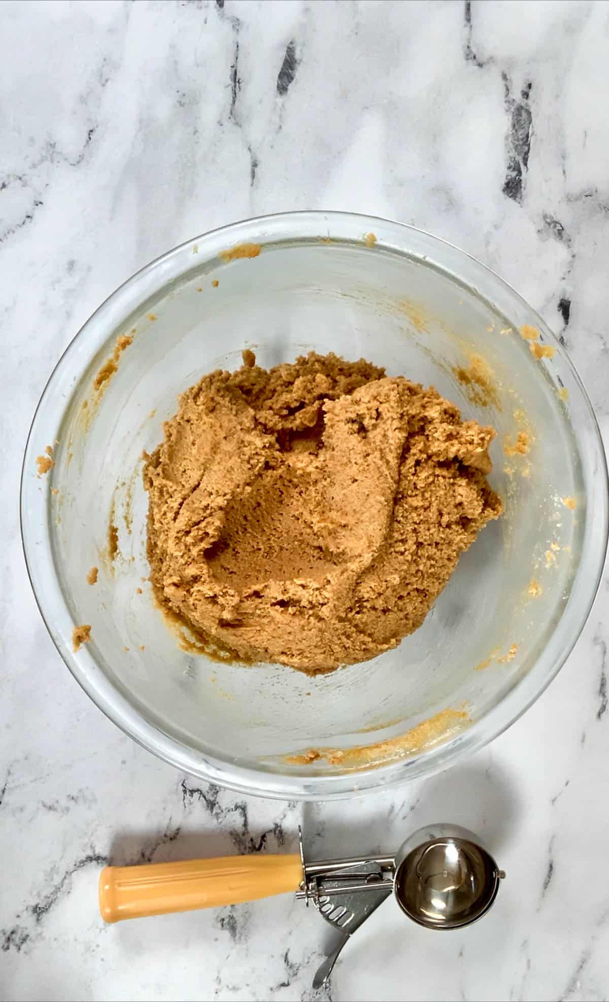 peanut butter dough along with an ice cream scoop. 