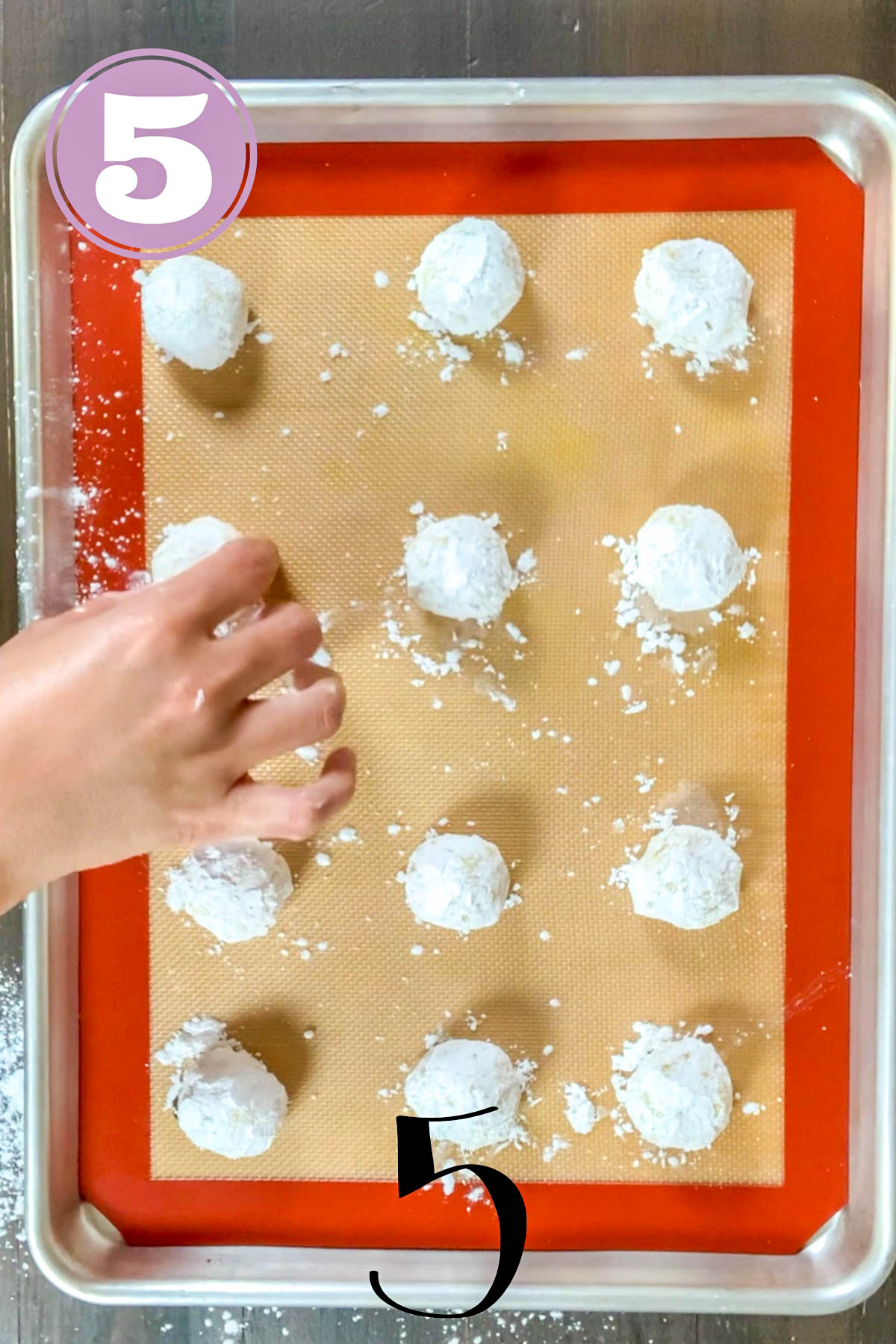 lemon crinkle cookies balls placed on a silicone mat ready to go to the oven.