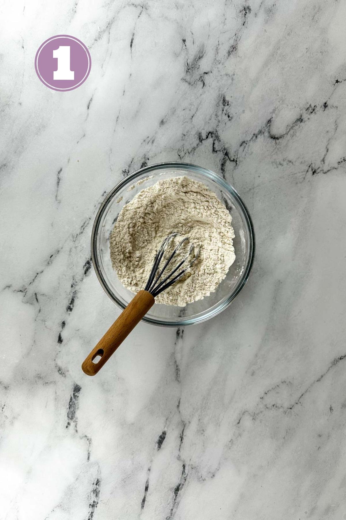 a bowl with all purpose flour, baking powder and salt whisked together.