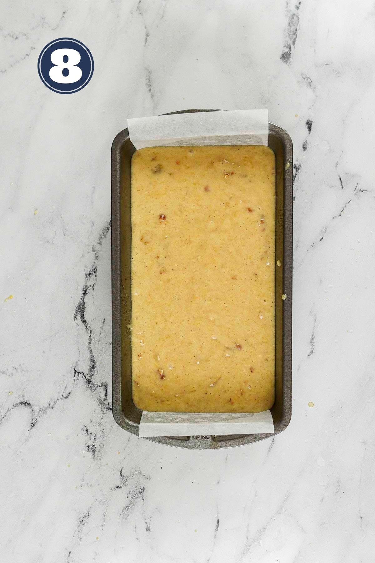 banana bread batter poured into 9 x 5 inch pan and ready to go to the oven.