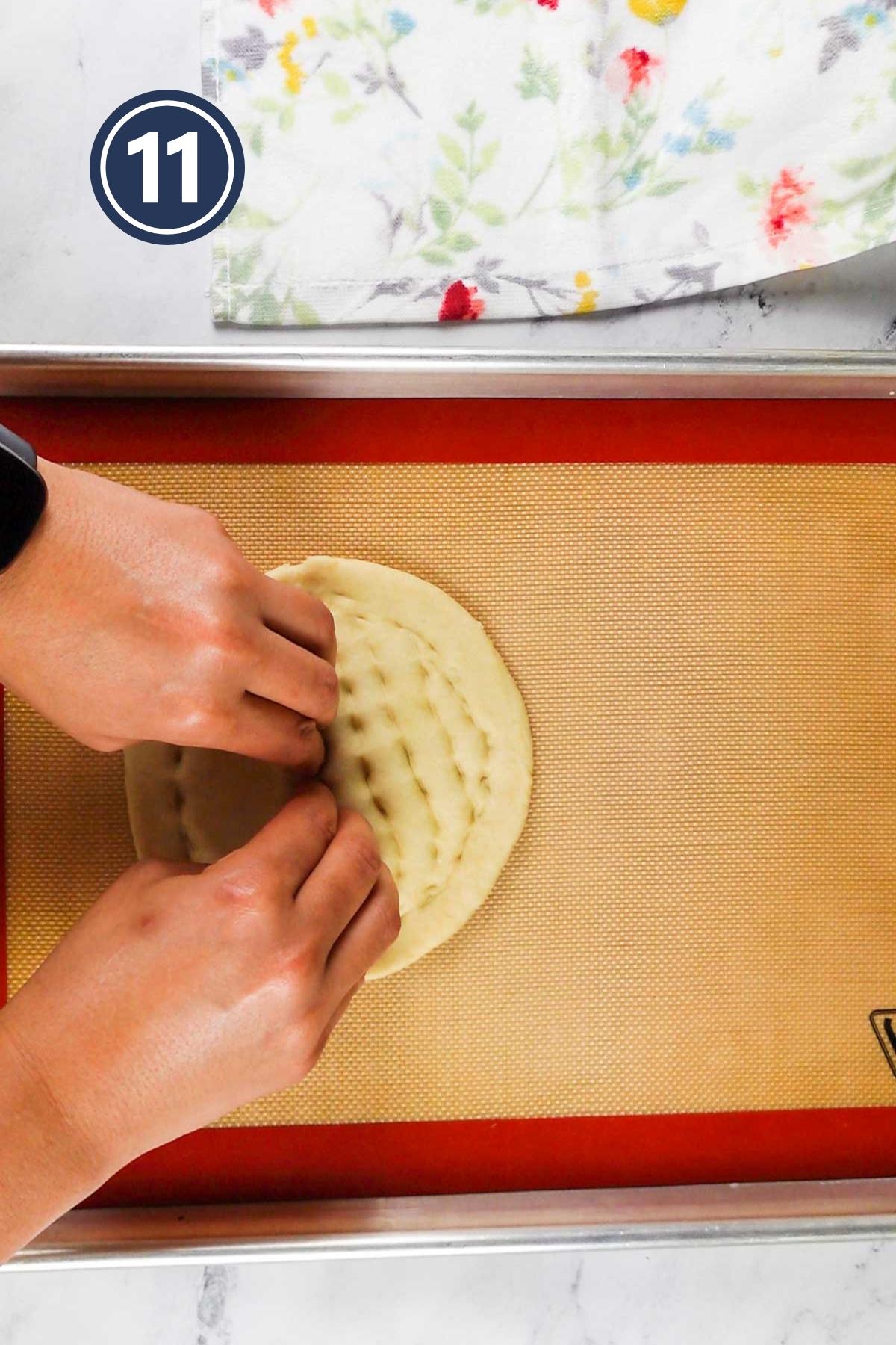 applying dents to the rolled out dough.