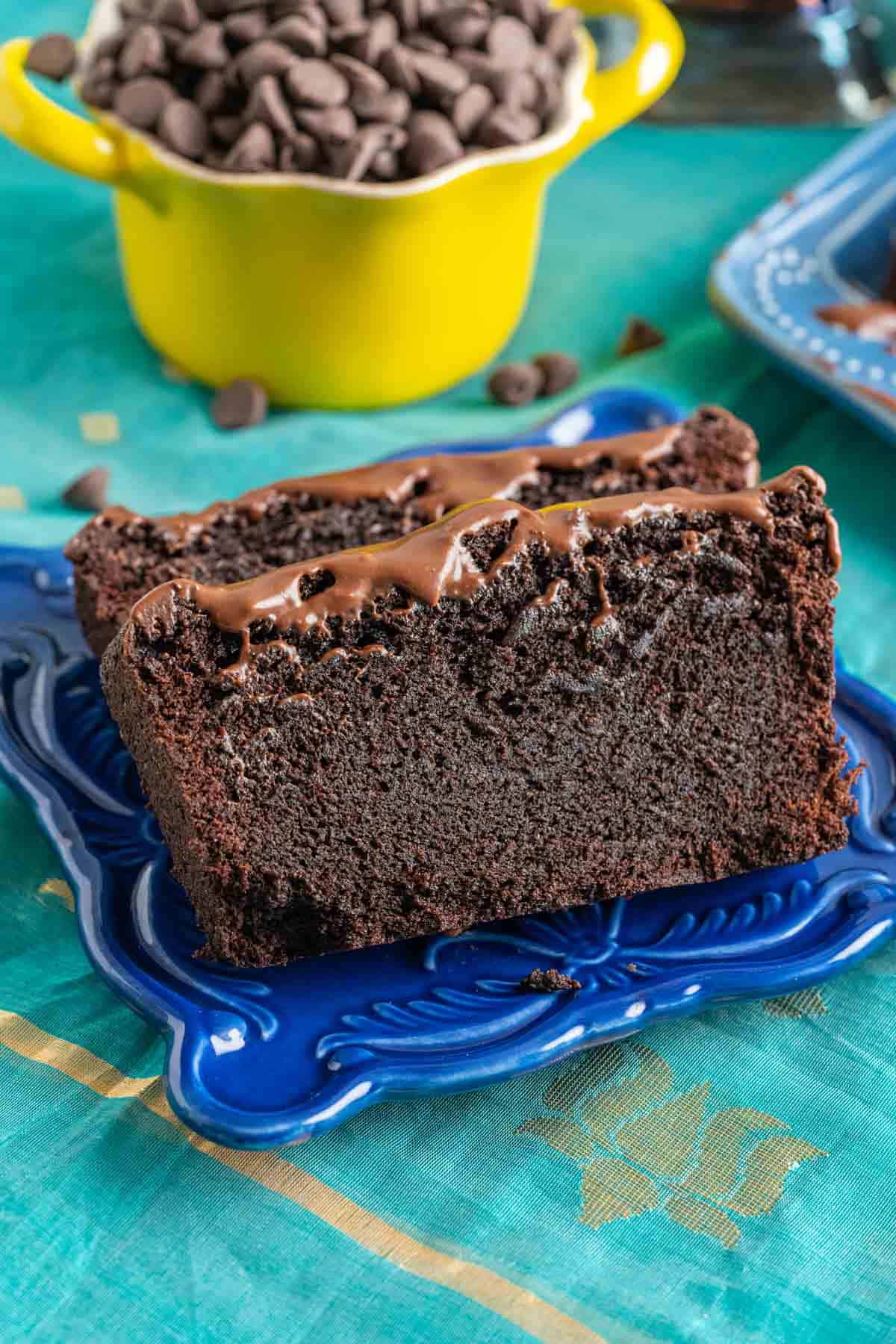 two slices of chocolate quick bread in a small blue plate.