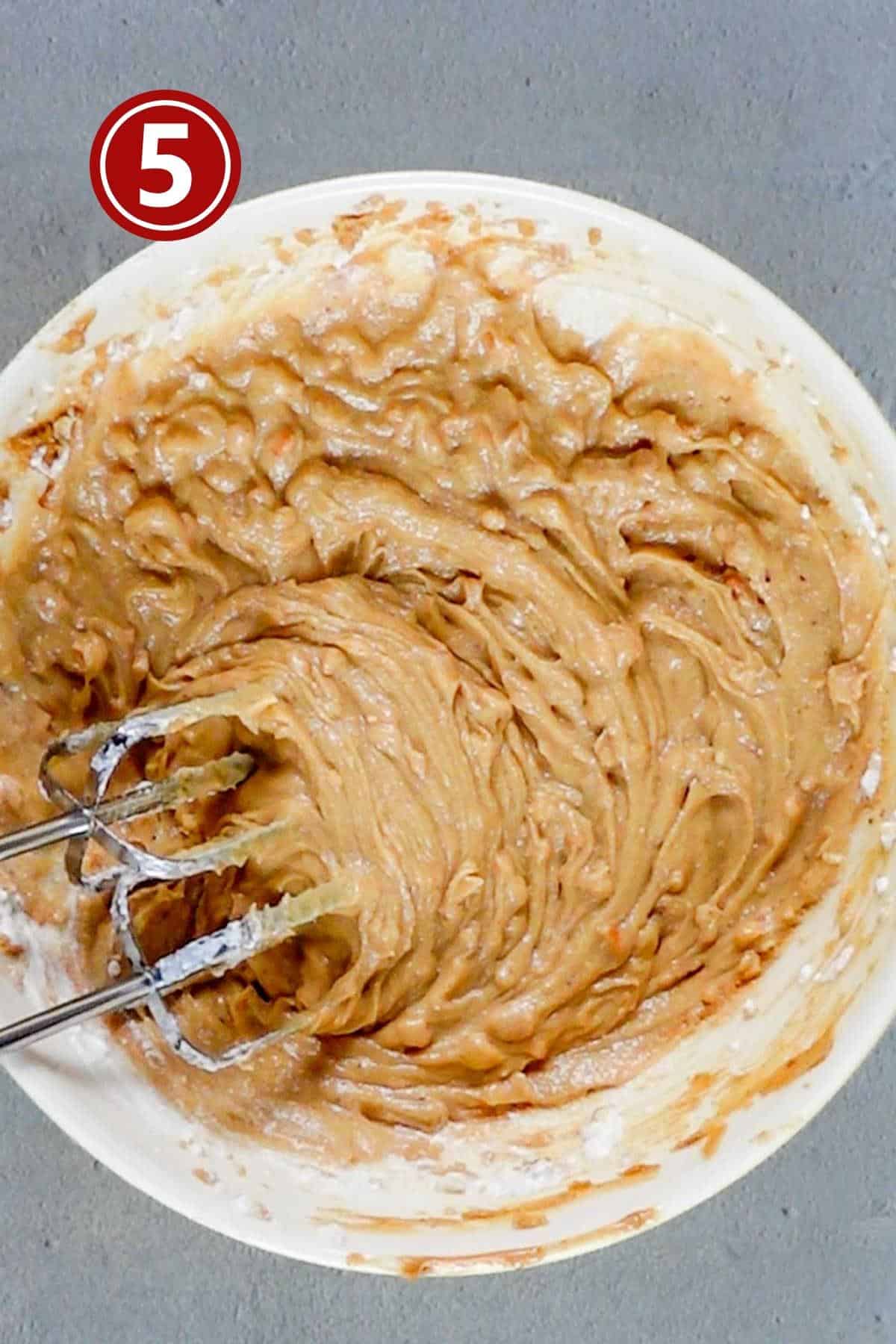 adding the sour cream to the wet ingredients of the peanut butter bread.
