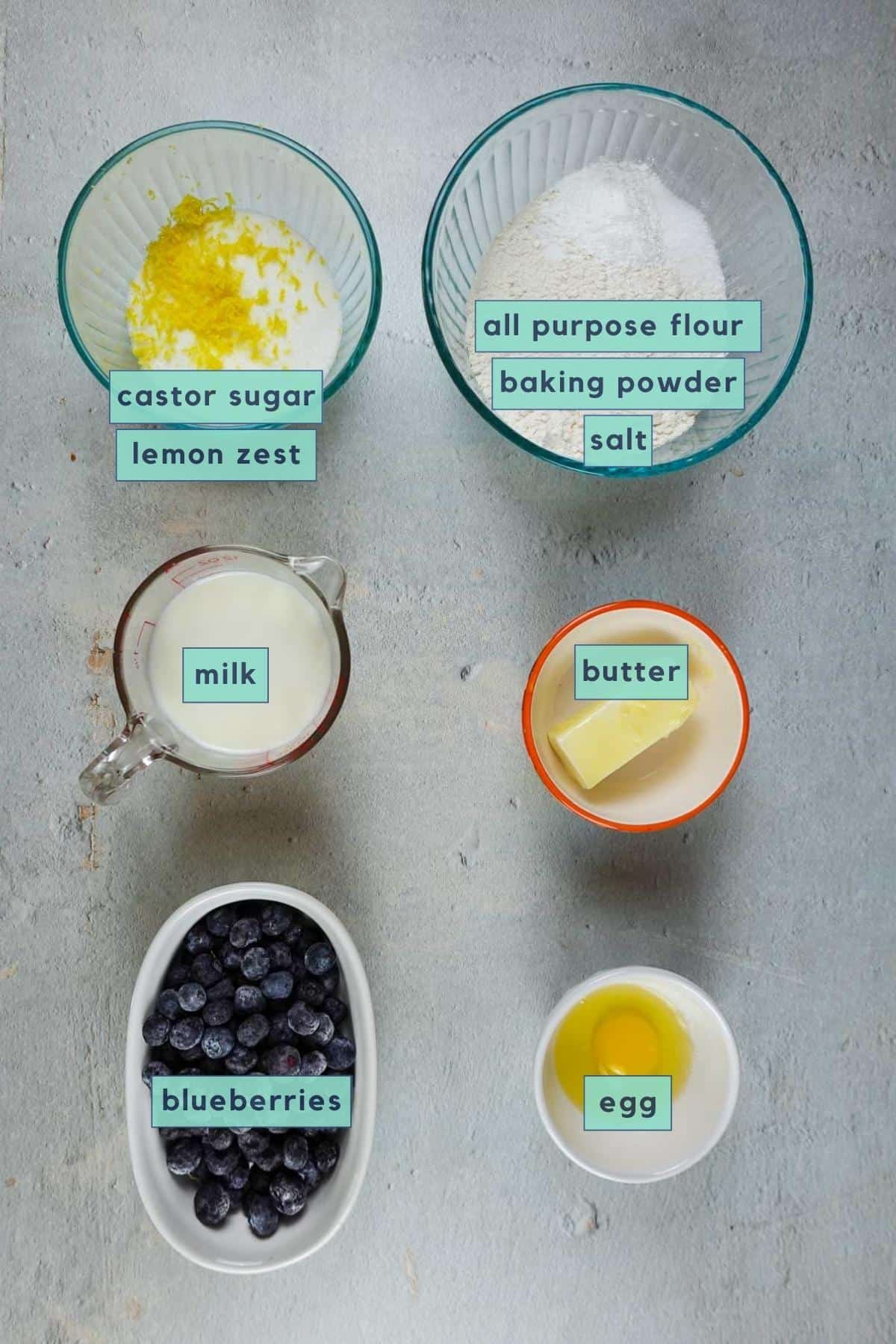 ingredients for blueberry cake with lemon glaze.