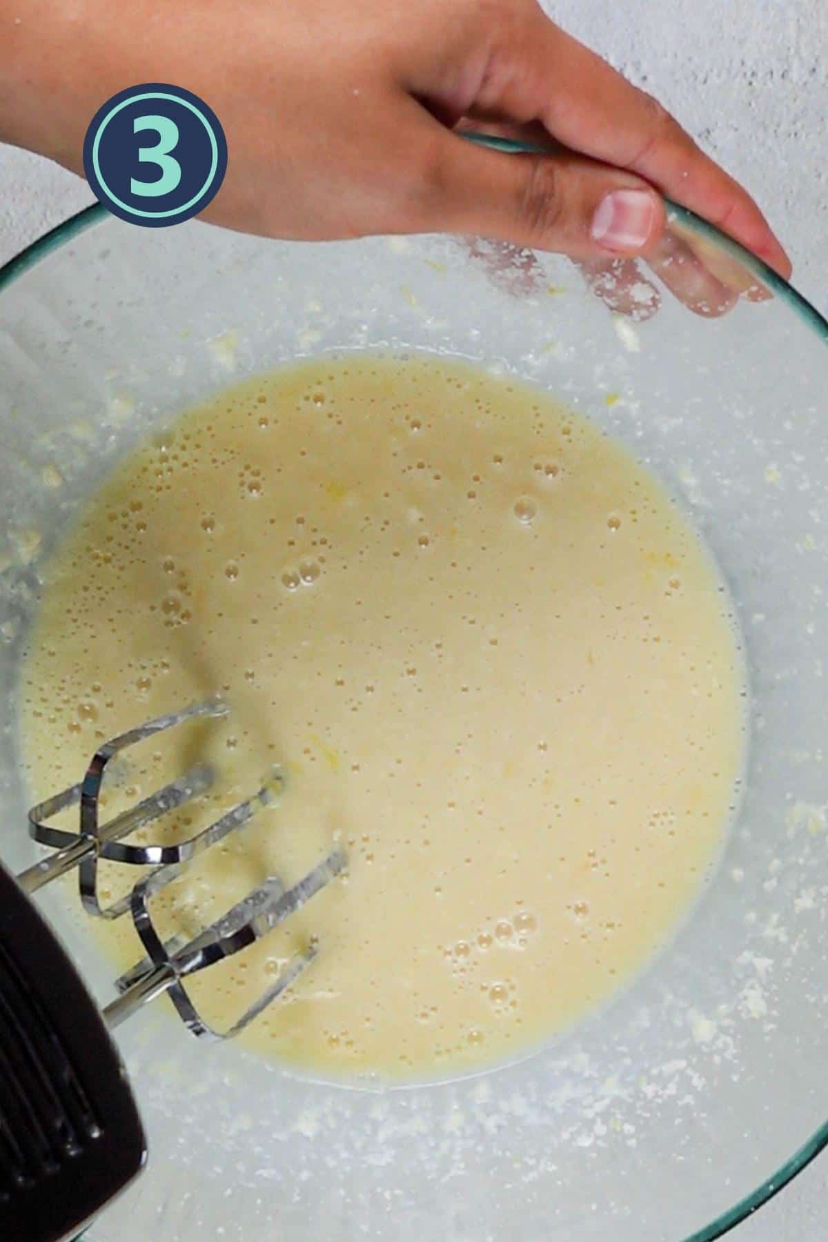 beating the eggs and vanilla extract in the butter mixture.