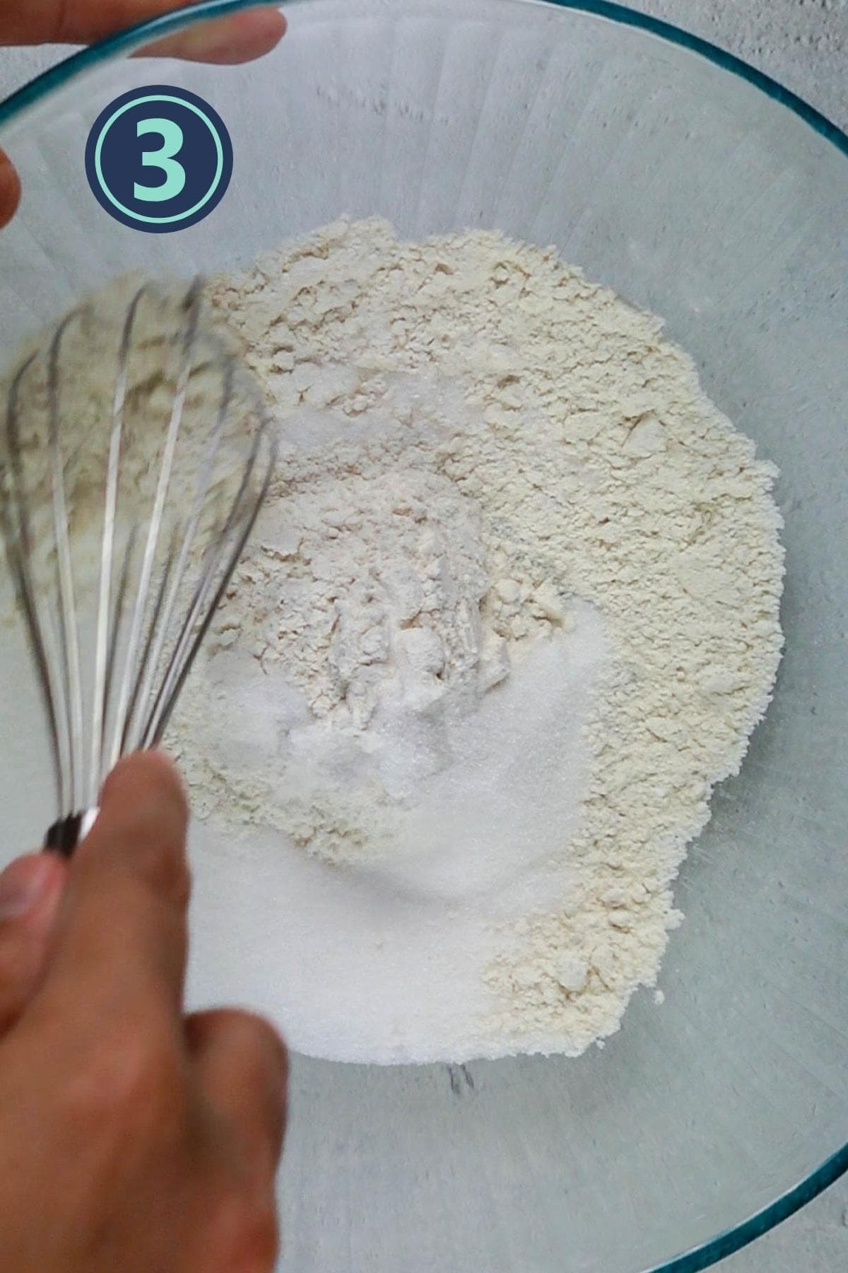 mixing the sugar and dry ingredients using a whisk.